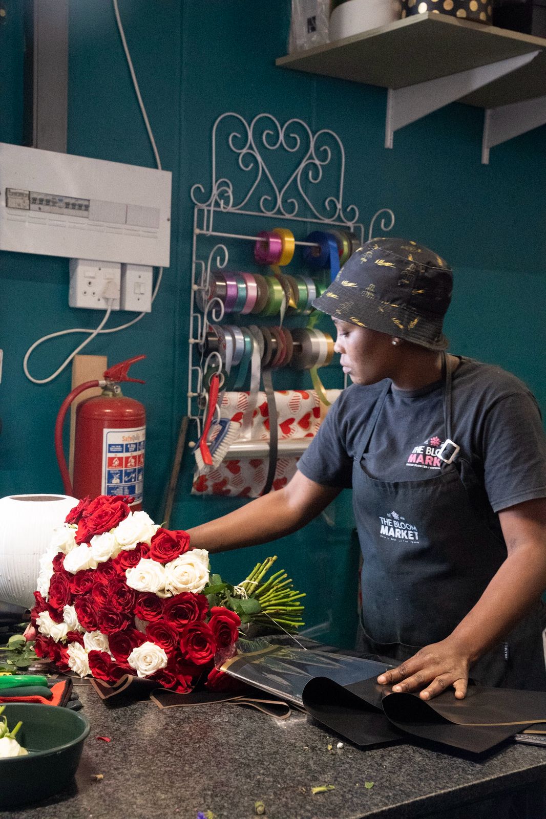 The Bloom Market florists handcrafting a floral arrangement